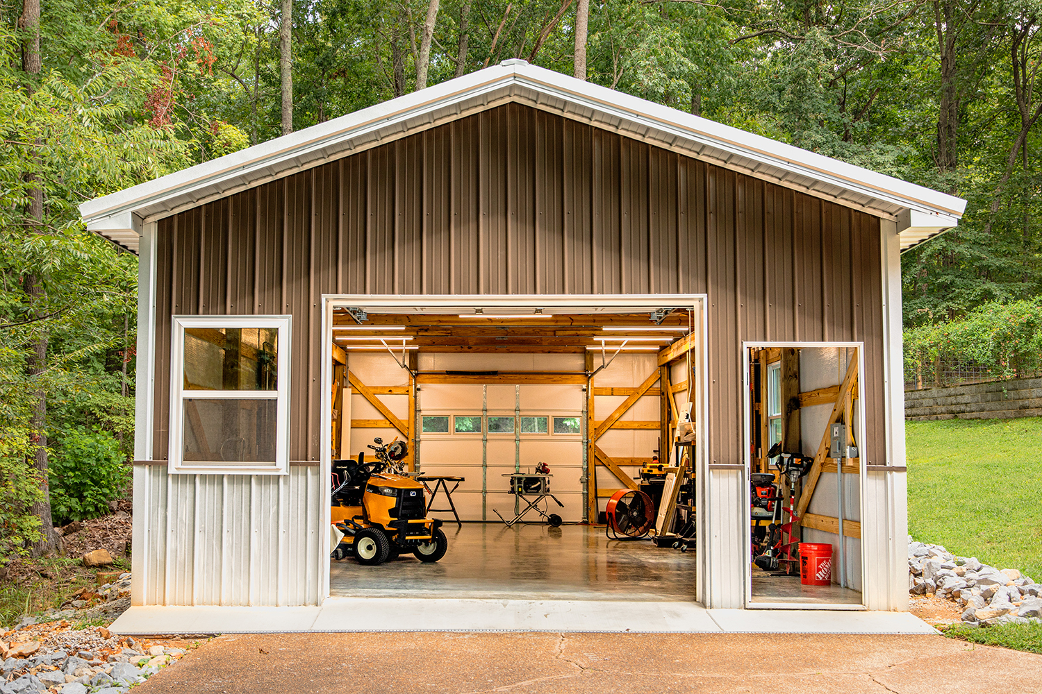 garage with drive through doors showing summer shield metal building insulation inside